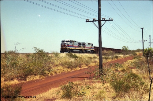 222-22
Somewhere on the original single line section between Gull and Rosella Hamersley Iron 7073 serial 47752 a General Electric Dash 9-44CW built by GE at Erie brings an empty train to a stop with 7091 for a crew change.
Keywords: 7073;GE;Dash-9-44CW;47752;