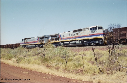 222-30
Somewhere on the original single line section between Gull and Rosella Hamersley Iron 7073 serial 47752 a General Electric Dash 9-44CW built by GE at Erie powers away with an empty train with sister Dash 9-44CW unit 7091 serial 47770 following a crew change with a loaded train.
Keywords: 7091;GE;Dash-9-44CW;47770;