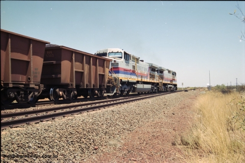 222-34
Somewhere on the original single line section between Gull and Rosella Hamersley Iron 7071 serial 47750 a General Electric Dash 9-44CW built by GE at Erie brings a loaded train away from the passing track back onto the mainline following a crew change with second unit 7066 serial 47745.
Keywords: 7066;GE;Dash-9-44CW;47745;