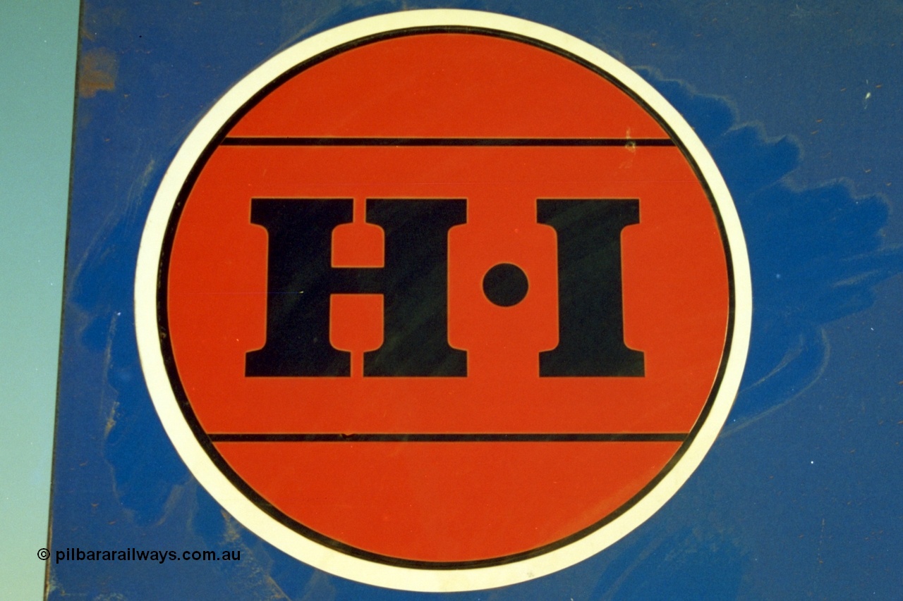 223-01
The HI red dot logo for Hamersley Iron on a sign near Rosella Siding. 21st October 2000.
