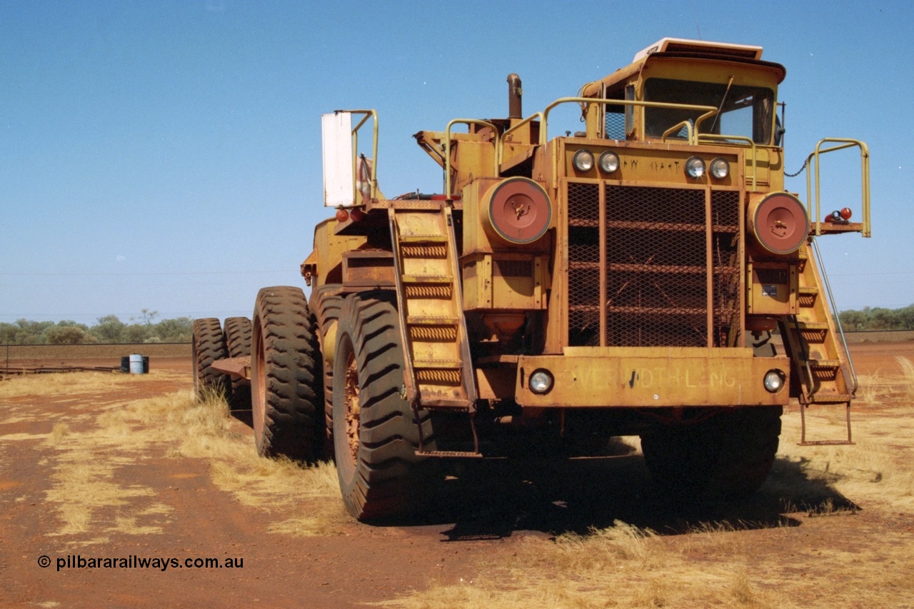 223-04
Rosella Siding, old Hamersley Iron machine transporter, prime mover is a KW Dart, possibly a model DE 2551. 21st October 2000.
Keywords: KW-Dart;DE2551;