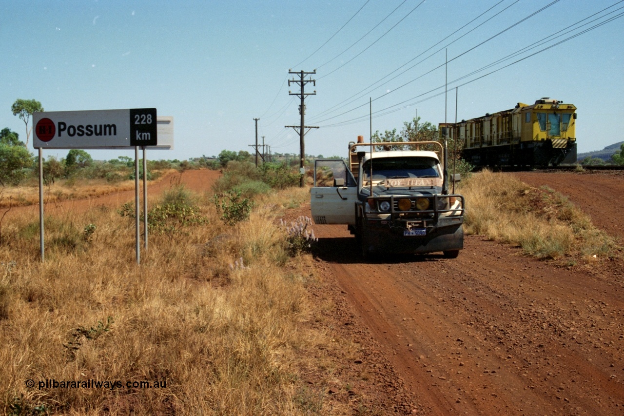 223-12
Possum Siding sign on the Hamersley Iron Dampier to Paraburdoo line, located 228 km from Dampier. 21st October 2000.
