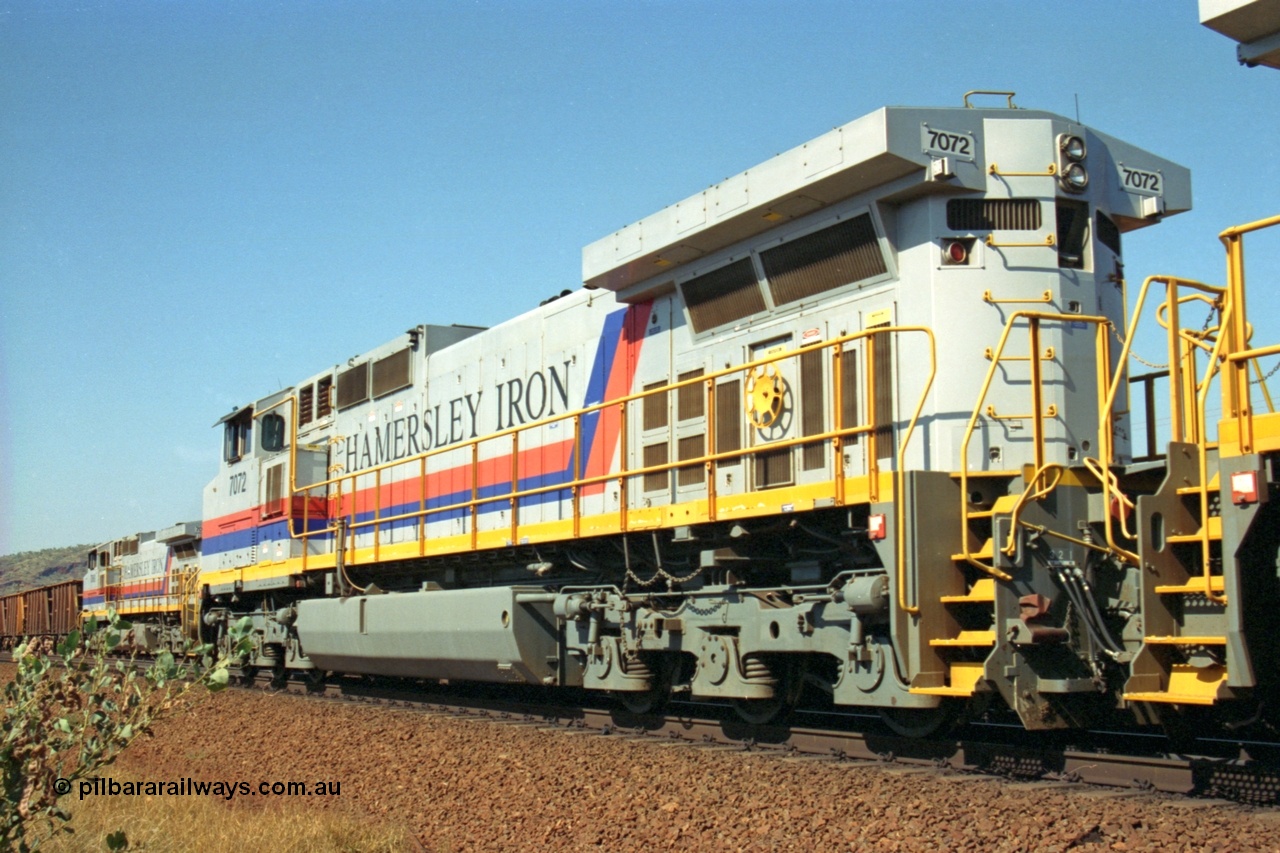 223-29
Possum Siding, rear view of Hamersley Iron loco 7072 a General Electric built Dash 9-44CW model serial 47751 leads sister unit 7074 with a loaded train as they effect a crew change. 21st October 2000.
Keywords: 7072;47751;GE;Dash-9-44CW;