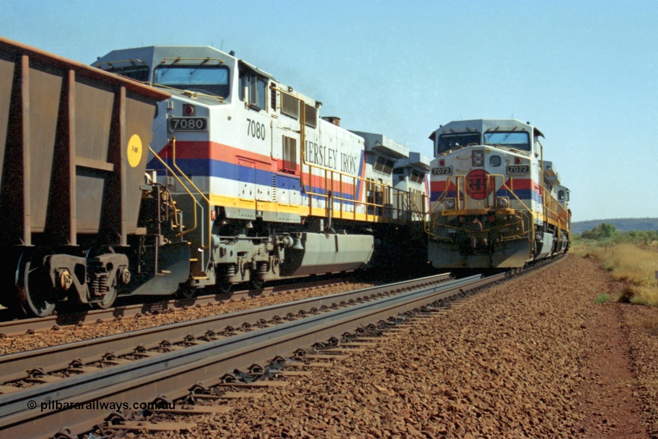 223-31
Possum Siding, a loaded train behind a pair of Hamersley Iron General Electric built Dash 9-44CW units 7072 serial 47751 and 7074 serial 47753 with the crew change completed, the empty is starting to roll on the passing track. 21st October 2000.
Keywords: 7072;47751;GE;Dash-9-44CW;