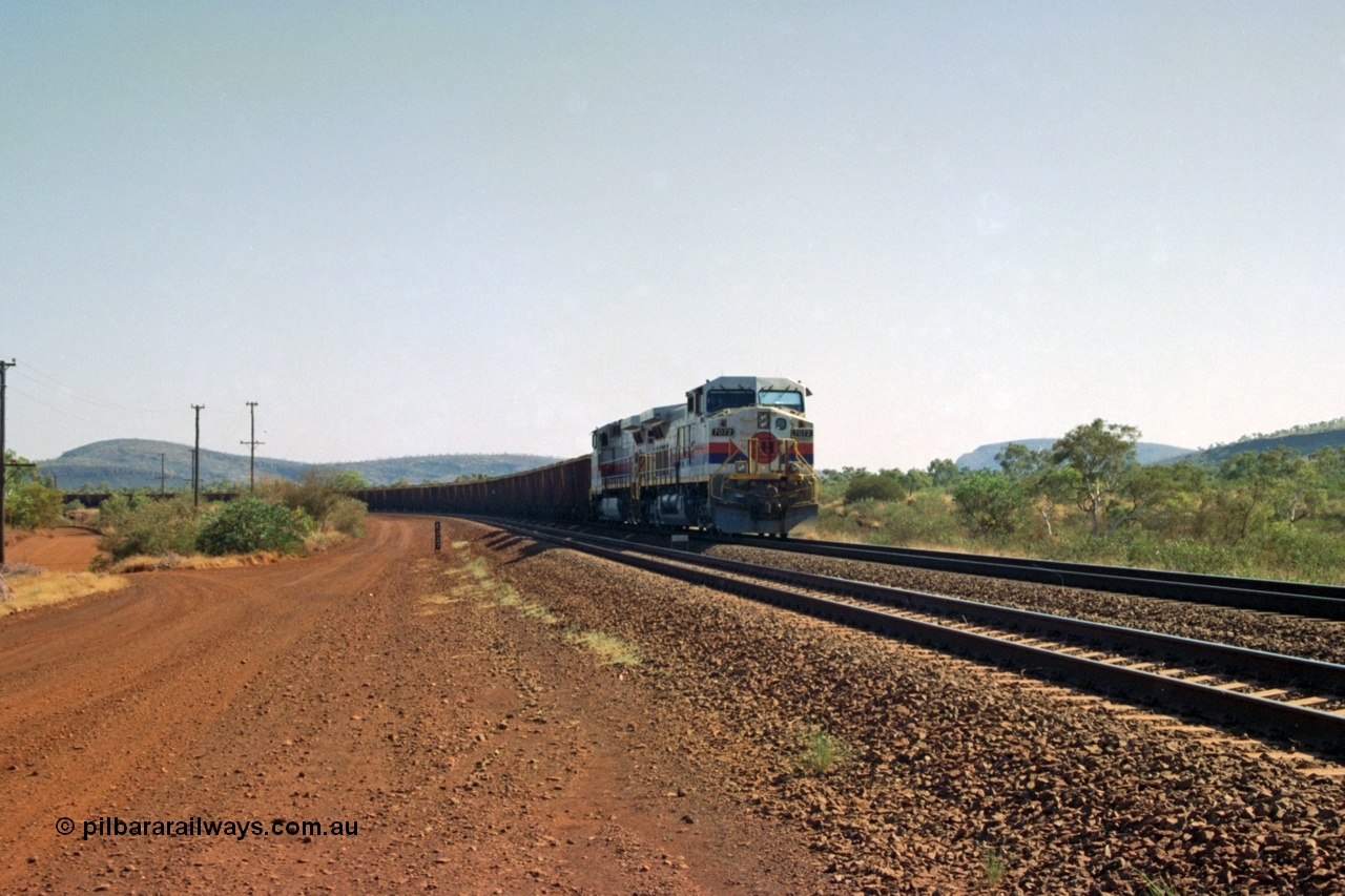 223-35
Possum Siding 227 km, a loaded train behind a pair of Hamersley Iron General Electric built Dash 9-44CW units 7072 serial 47751 and 7074 serial 47753 on a loaded train ex Marandoo holds the mainline awaiting clearance north. 21st October 2000.
Keywords: 7072;47751;GE;Dash-9-44CW;
