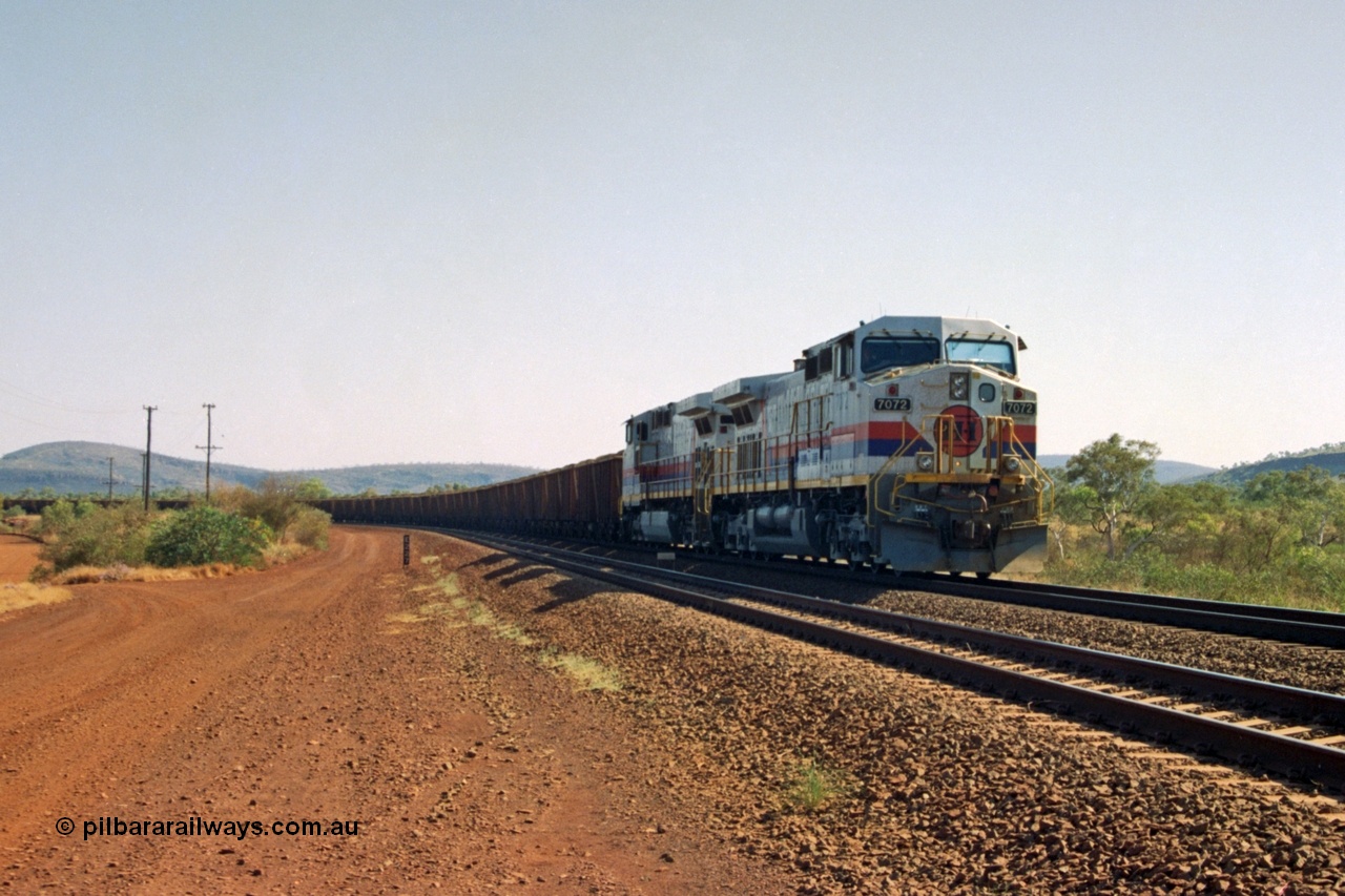 223-36
Possum Siding 227 km, a loaded train behind a pair of Hamersley Iron General Electric built Dash 9-44CW units 7072 serial 47751 and 7074 serial 47753 on a loaded train ex Marandoo holds the mainline awaiting clearance north. 21st October 2000.
Keywords: 7072;47751;GE;Dash-9-44CW;