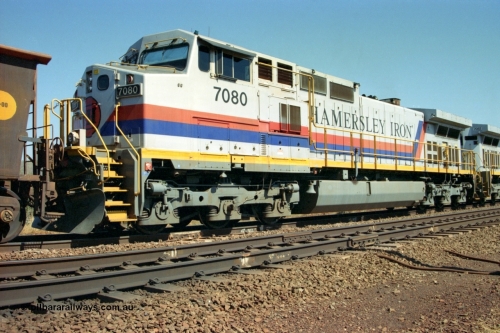 223-17
Possum Siding, trailing view of Hamersley Iron loco 7080 a General Electric built Dash 9-44CW serial 47759 second unit behind sister locomotive 7082 looking south. 21st October 2000.
Keywords: 7080;GE;Dash-9-44CW;47759;