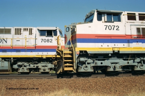 223-26
Possum Siding, Hamersley Iron locos built by General Electric model Dash 9-44CW units 7072 serial 47751 with 210 waggons loaded ex Marandoo changes crew with sister loco 7082 serial 47761 on an empty at 1500 hrs 21st October 2000.
Keywords: 7072;GE;Dash-9-44CW;47751;