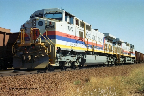 223-33
Possum Siding, a loaded train behind a pair of Hamersley Iron General Electric built Dash 9-44CW units 7072 serial 47751 and 7074 serial 47753 on a loaded train ex Marandoo with the crew change completed, the empty is rolling past on the passing track. 21st October 2000.
Keywords: 7072;GE;Dash-9-44CW;47751;