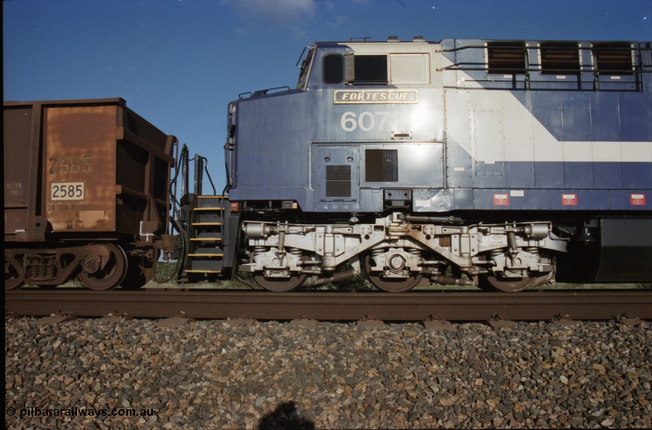 224-10
Bing siding, 6073 'Fortescue' serial 51065 a General Electric AC6000 built by GE at Erie awaits the road to depart south, cab side shows new nameplate, steerable bogie and taper in cab side. [url=https://goo.gl/maps/KQrczNpVhAH2]GeoData[/url].
Keywords: 6073;51065;GE;AC6000;
