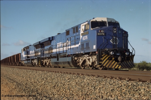 224-02
Bing siding, the afternoon empty to Yandi was a staple of the AC6000 units when delivered, operating the train as a pair, 112 waggons, AC6000 and 112 waggons. 6076 'Mt Goldsworthy' serial 51068 a General Electric AC6000 built by GE at Erie awaits the road to depart south with sister unit 6073. [url=https://goo.gl/maps/KQrczNpVhAH2]GeoData[/url].
Keywords: 6076;GE;AC6000CW;51068;