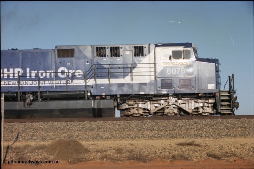 224-18
Bing siding, 6076 'Mt Goldsworthy' serial 51068 a General Electric AC6000 built by GE at Erie awaits the road to depart south, cab side shows new nameplate, steerable bogie and taper in cab side. [url=https://goo.gl/maps/KQrczNpVhAH2]GeoData[/url].
Keywords: 6076;GE;AC6000CW;51068;
