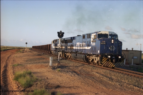 224-34
Bing siding, the afternoon empty to Yandi was a staple of the AC6000 units when delivered, operating the train as a pair, 112 waggons, AC6000 and 112 waggons. 6076 'Mt Goldsworthy' serial 51068 a General Electric AC6000 built by GE at Erie departs the loop south with sister unit 6073. [url=https://goo.gl/maps/KQrczNpVhAH2]GeoData[/url].
Keywords: 6076;GE;AC6000CW;51068;