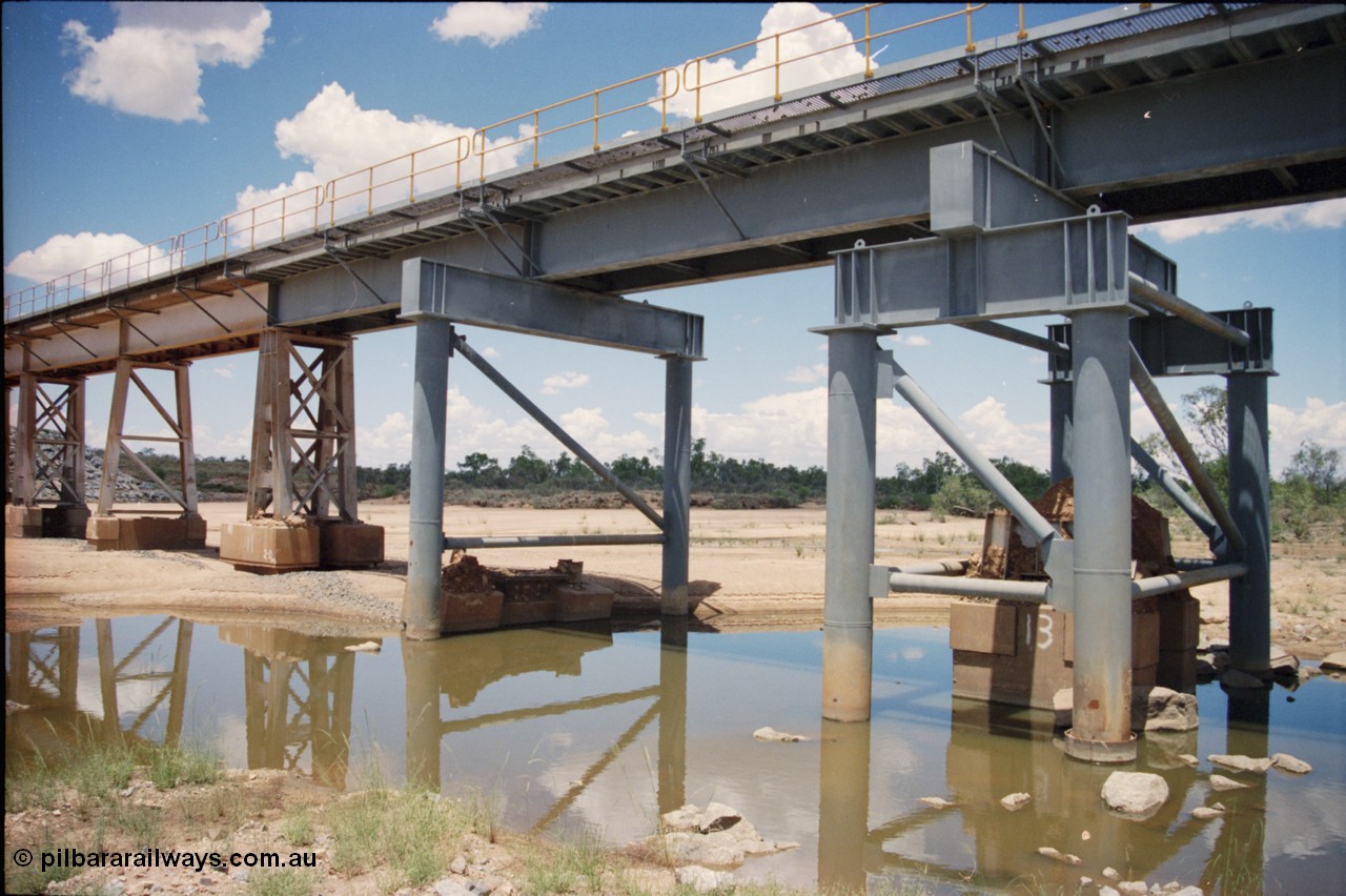 226-02
Yule River bridge showing new piles and deck to replace flood damaged piles after a cyclone that closed the line for two weeks in the late 1990s. [url=https://goo.gl/maps/G67Mat23u4P2]GeoData[/url].

