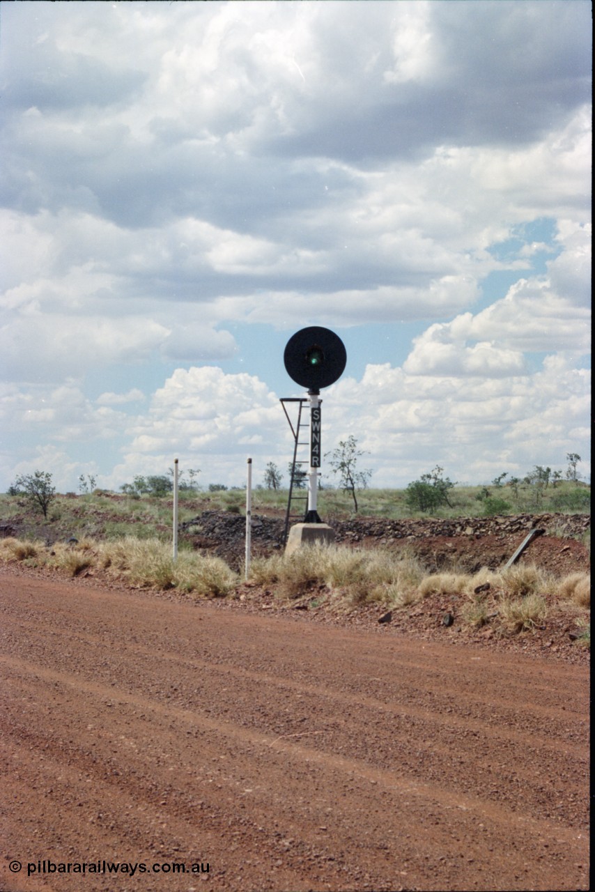 226-19
Shaw North, 216.5 km, departure repeater signal post SWN 4R for the mainline is aimed across the 700 metre radius curve that north bound trains face. [url=https://goo.gl/maps/emPzCHvnzAJ2]GeoData[/url].
