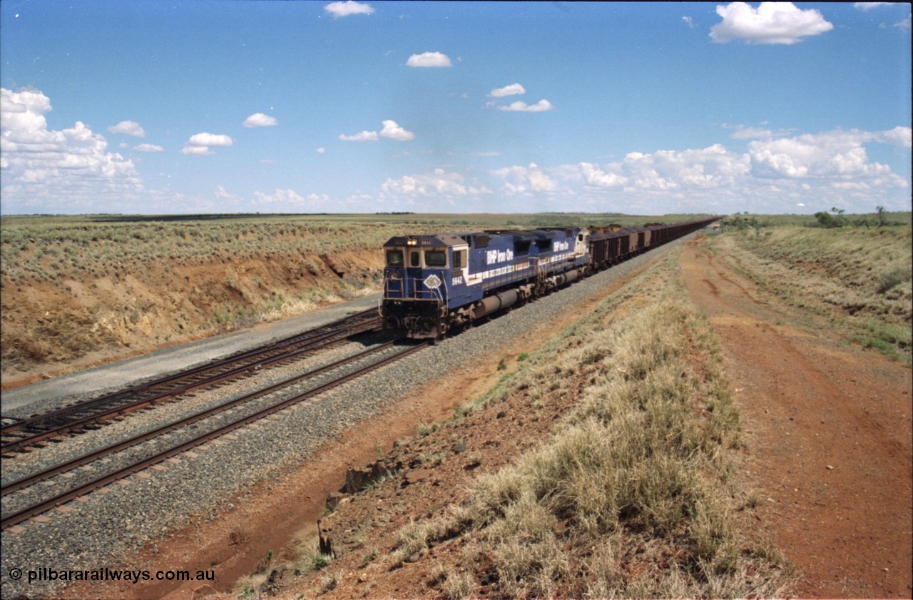 226-27
Shaw siding at the 219 km a loaded train with power from two Goninan CM40-8M GE rebuild units 5642 'Wallareenya' serial 8281-07 / 92-131 and sister unit 5636, the mid-train remotes can be seen in the distance topping the grade. [url=https://goo.gl/maps/JLjSYskHScU2]GeoData[/url].
Keywords: 5642;Goninan;GE;CM40-8M;8281-07/92-131;rebuild;AE-Goodwin;ALCo;C636;5467;G6041-3;