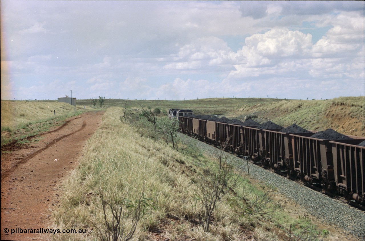 226-30
Shaw siding, the loaded train heading north behind two Goninan CM40-8M GE rebuild units with loaded Comeng WA built waggons and a couple of the smooth sided experimental Comeng waggons. [url=https://goo.gl/maps/JLjSYskHScU2]GeoData[/url].
