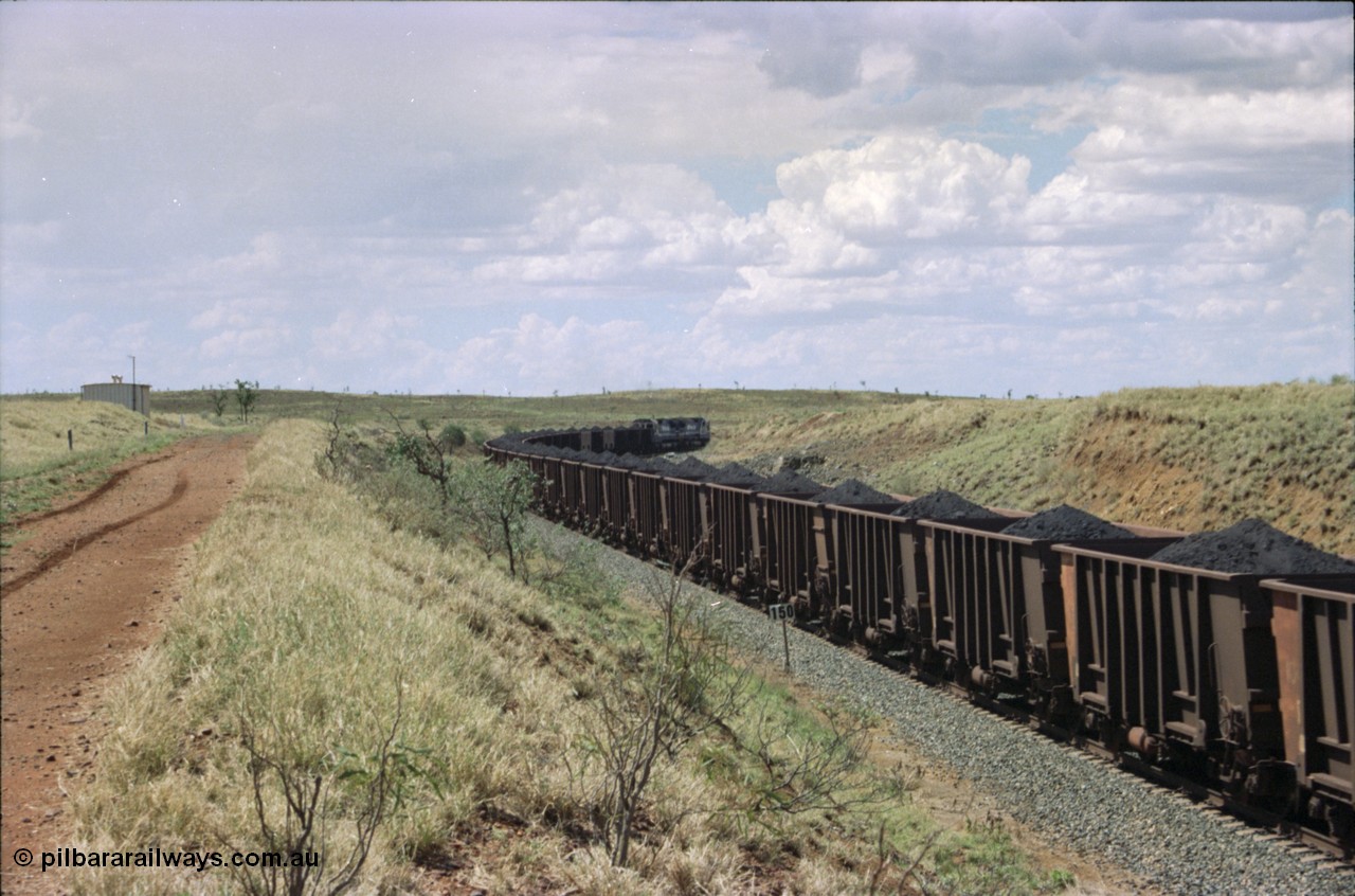 226-31
Shaw siding, the loaded train heading north around the 698 metre radius curve behind two Goninan CM40-8M GE rebuild units with loaded Comeng WA built waggons. [url=https://goo.gl/maps/JLjSYskHScU2]GeoData[/url].

