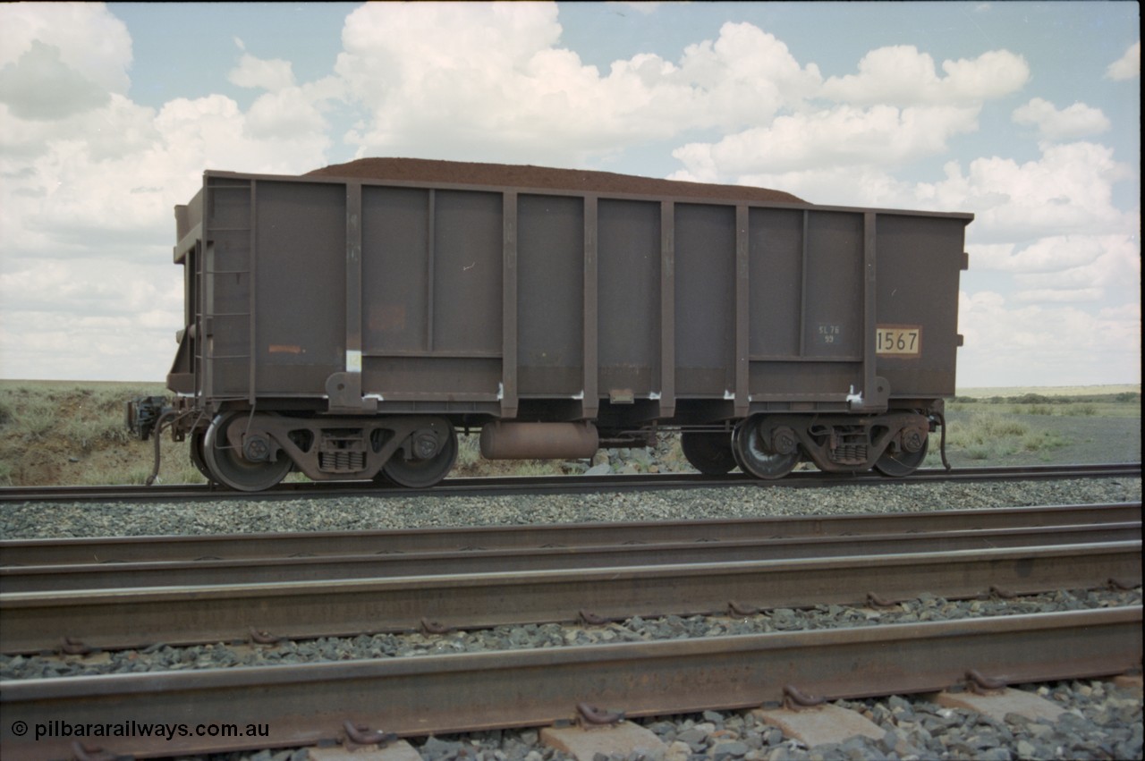 226-37
Shaw siding back track, 219 km, a defected waggon has been cut off a loaded Yandi train, waggon 1567 is a Comeng WA build from a batch of 288 built in 1974. [url=https://goo.gl/maps/JLjSYskHScU2]GeoData[/url].
Keywords: 1567;Comeng-WA;BHP-ore-waggon;
