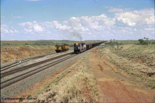 226-24
Shaw siding at the 219 km a loaded train with standard double CM40-8M power blasts along the mainline with the rear portion still on a .55 percent grade as it passes the Speno rail grinder in the back track. [url=https://goo.gl/maps/JLjSYskHScU2]GeoData[/url].
