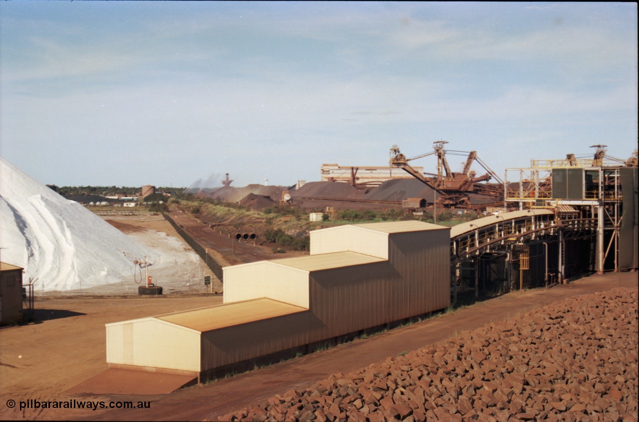 227-12
Nelson Point, view from rear of Shiploader 2, salt pile, manganese stockpile in the distance, stacker 3, the Port Hedland water tower, then 101-102 sample station and Tertiary Crushing Building One or TCB1, stacker 4 and reclaimer 3 with the under harbour portal in the foreground. [url=https://goo.gl/maps/1sLxDMF5tZu]GeoData[/url].
