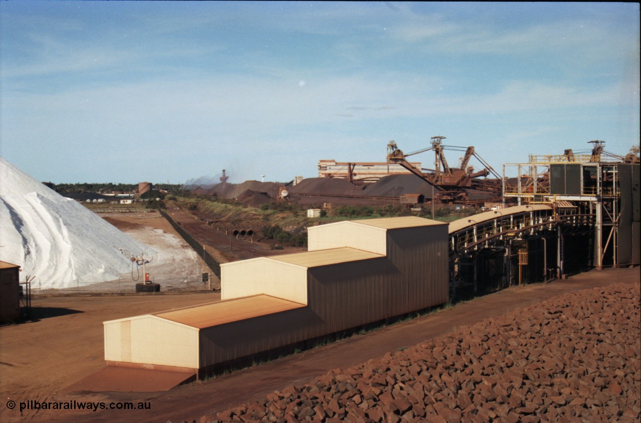227-13
Nelson Point, view from rear of Shiploader 2, salt pile, manganese stockpile in the distance, stacker 3, the Port Hedland water tower, then 101-102 sample station and Tertiary Crushing Building One or TCB1, stacker 4 and reclaimer 3 with the under harbour portal in the foreground. [url=https://goo.gl/maps/1sLxDMF5tZu]GeoData[/url].
