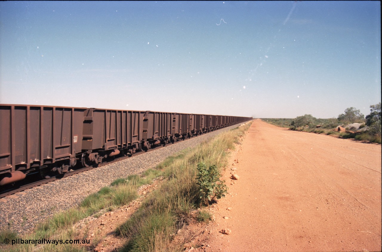 227-26
30 km looking south, empty ore train with mostly Comeng built ore waggons. [url=https://goo.gl/maps/BY7Zz4F5t822]GeoData[/url].
