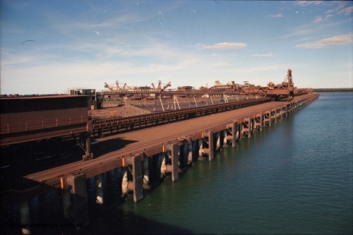 227-02
Nelson Point, view along A and B berths from Shiploader 2, Shiploader 1 on B berth, reclaimers 3 and 4 visible behind the under harbour tunnel feed conveyor. [url=https://goo.gl/maps/9YFk9Z8c7WG2]GeoData[/url].
