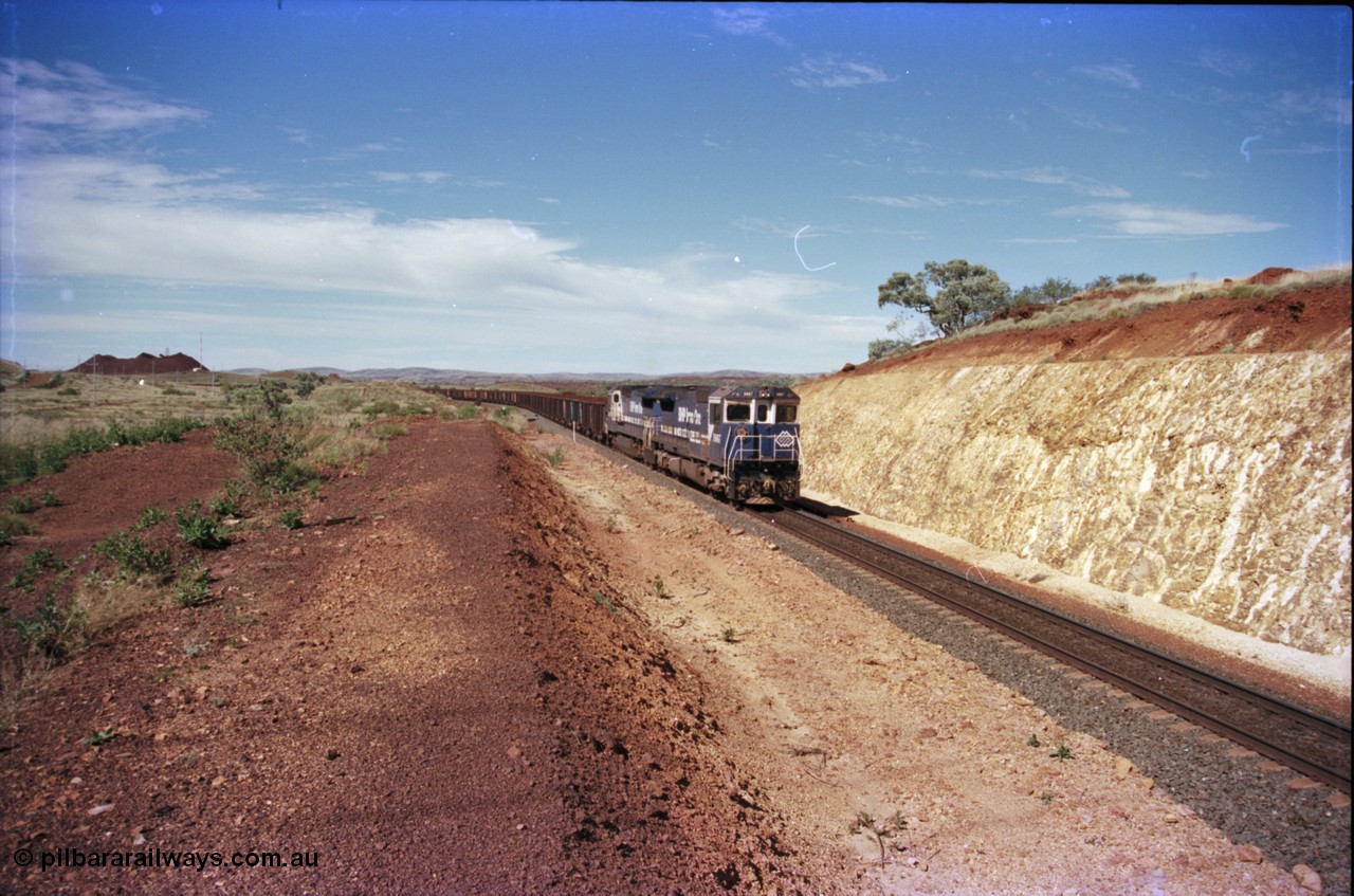228-04
Yandi One, a loaded train coming off the balloon loop, this area is near the new MAC Junction. Stockpile and radio repeater in the background.
Keywords: 5667;Goninan;GE;CM40-8MEFI;8412-12/94-158;rebuild;Comeng-NSW;ALCo;M636C;5485;C6084-1;