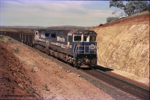 228-05
Yandi One, a loaded train creeps towards the Y308.1 km grade crossing while loading a train at 0.9 km/h. Goninan GE CM40-8MEFI rebuild unit 5667 'Redcar' serial 8412-12/94-158 leads an unidentified CM40-8 new build unit, either 5646 or 5647.
Keywords: 5667;Goninan;GE;CM40-8MEFI;8412-12/94-158;rebuild;Comeng-NSW;ALCo;M636C;5485;C6084-1;