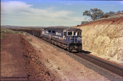 228-06
Yandi One, a loaded train creeps towards the Y308.1 km grade crossing while loading a train at 0.9 km/h. Goninan GE CM40-8MEFI rebuild unit 5667 'Redcar' serial 8412-12/94-158 leads an unidentified CM40-8 new build unit, either 5646 or 5647.
Keywords: 5667;Goninan;GE;CM40-8MEFI;8412-12/94-158;rebuild;Comeng-NSW;ALCo;M636C;5485;C6084-1;