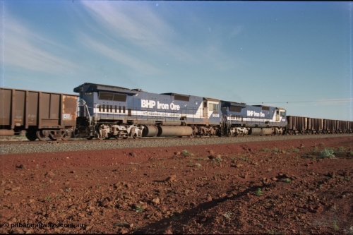 228-24
Yandi Two branch, trailing shot of the afternoon empty train mid-train remotes heading west near the YT307 km in the form of elephant style Goninan final rebuild GE CM40-8MEFI model unit 5669 'Beilun' serial 8412-02/95-160 and CM40-8M model 5638 'Mallina' serial 8281-02/92-127. Geodata [url=https://goo.gl/maps/S1bX3ycGXqE2] -22.706976, 119.097651 [/url].
Keywords: 5638;Goninan;GE;CM40-8M;8281-02/92-127;rebuild;AE-Goodwin;ALCo;C636;5464;G6035-5;