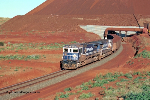 229-25
Yandi Two loadout exit side, Goninan rebuild CM40-8M GE units 5650 'Yawata' serial 8412-07 / 93-141 and sister unit 5642 drag a loading train at 1.2 km/h, both units carry the BHP Iron Ore teal and marigold livery for the logo. [url=https://goo.gl/maps/KQ3dQNrTwd42]GeoData[/url].
Keywords: 5650;Goninan;GE;CM40-8M;8412-07/93-141;rebuild;AE-Goodwin;ALCo;M636C;5481;G6061-2;