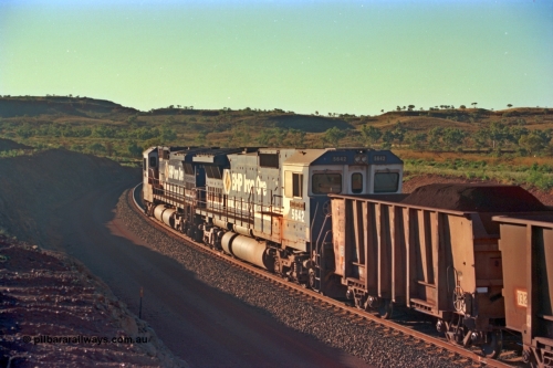 229-33
Yandi Two loadout exit side, as second unit 5642 'Wallareenya' serial 8281-07 / 92-131 a Goninan rebuild CM40-8M GE unit trails sister unit 5650 drag a loading train at 1.2 km/h around the loadout balloon, the waggon behind 5642 is an original Oroville waggon. [url=https://goo.gl/maps/KQ3dQNrTwd42]GeoData[/url].
Keywords: 5642;Goninan;GE;CM40-8M;8281-07/92-131;rebuild;AE-Goodwin;ALCo;C636;5467;G6041-3;