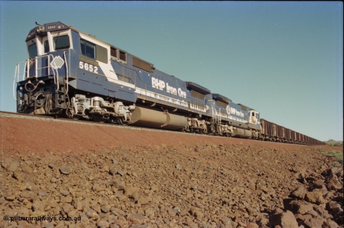 231-21
Yandi Two balloon loop, BHP Iron Ore 5652 'Villanueva' serial 8412-09 / 93-143 an Goninan WA rebuild CM40-8M GE unit loads a train at 1.2 km/h with second unit 5650. [url=https://goo.gl/maps/3vQHZqBXNa32]GeoData[/url].
Keywords: 5652;Goninan;GE;CM40-8M;8412-09/93-143;rebuild;AE-Goodwin;ALCo;M636C;5482;G6061-3;