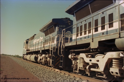 231-22
Yandi Two balloon loop, BHP Iron Ore 5652 'Villanueva' serial 8412-09 / 93-143 an Goninan WA rebuild CM40-8M GE unit loads a train at 1.2 km/h, note the silver logo on the rear and the missing logo from the hood, the round style fuel tanks tells us this units was rebuilt from an AE Goodwin built M636 ALCo. [url=https://goo.gl/maps/3vQHZqBXNa32]GeoData[/url].
Keywords: 5652;Goninan;GE;CM40-8M;8412-09/93-143;rebuild;AE-Goodwin;ALCo;M636C;5482;G6061-3;