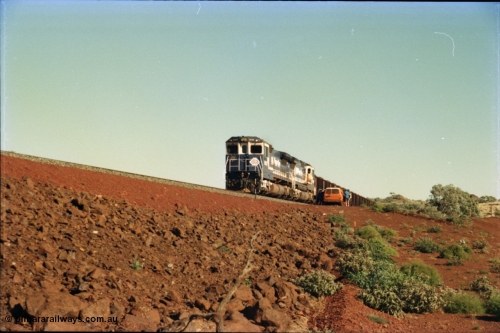231-24
Yandi Two balloon loop, BHP Iron Ore 5652 'Villanueva' serial 8412-09 / 93-143 an Goninan WA rebuild CM40-8M GE unit loads a train at 1.2 km/h with second unit 5650 as the outgoing crew arrive to change out. [url=https://goo.gl/maps/3vQHZqBXNa32]GeoData[/url].
Keywords: 5652;Goninan;GE;CM40-8M;8412-09/93-143;rebuild;AE-Goodwin;ALCo;M636C;5482;G6061-3;