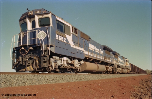 231-27
Yandi Two balloon loop, BHP Iron Ore 5652 'Villanueva' serial 8412-09 / 93-143 an Goninan WA rebuild CM40-8M GE unit loads a train at 1.2 km/h with second unit 5650. [url=https://goo.gl/maps/3vQHZqBXNa32]GeoData[/url].
Keywords: 5652;Goninan;GE;CM40-8M;8412-09/93-143;rebuild;AE-Goodwin;ALCo;M636C;5482;G6061-3;