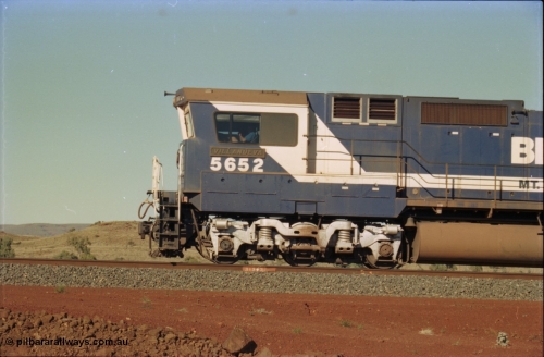231-28
Yandi Two balloon loop, BHP Iron Ore 5652 'Villanueva' serial 8412-09 / 93-143 an Goninan WA rebuild CM40-8M GE unit loads a train at 1.2 km/h, note the missing logo from the hood and the round style fuel tanks tells us this units was rebuilt from an AE Goodwin built M636 ALCo. [url=https://goo.gl/maps/3vQHZqBXNa32]GeoData[/url].
Keywords: 5652;Goninan;GE;CM40-8M;8412-09/93-143;rebuild;AE-Goodwin;ALCo;M636C;5482;G6061-3;