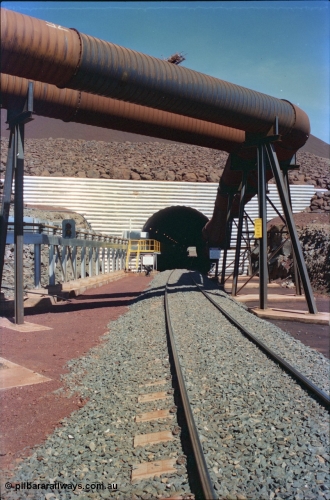 232-01
Yandi Two entry portal for the loadout tunnel with dust extraction pipes. February 1997. [url=https://goo.gl/maps/uMdxcaCKSdm]GeoData[/url].
