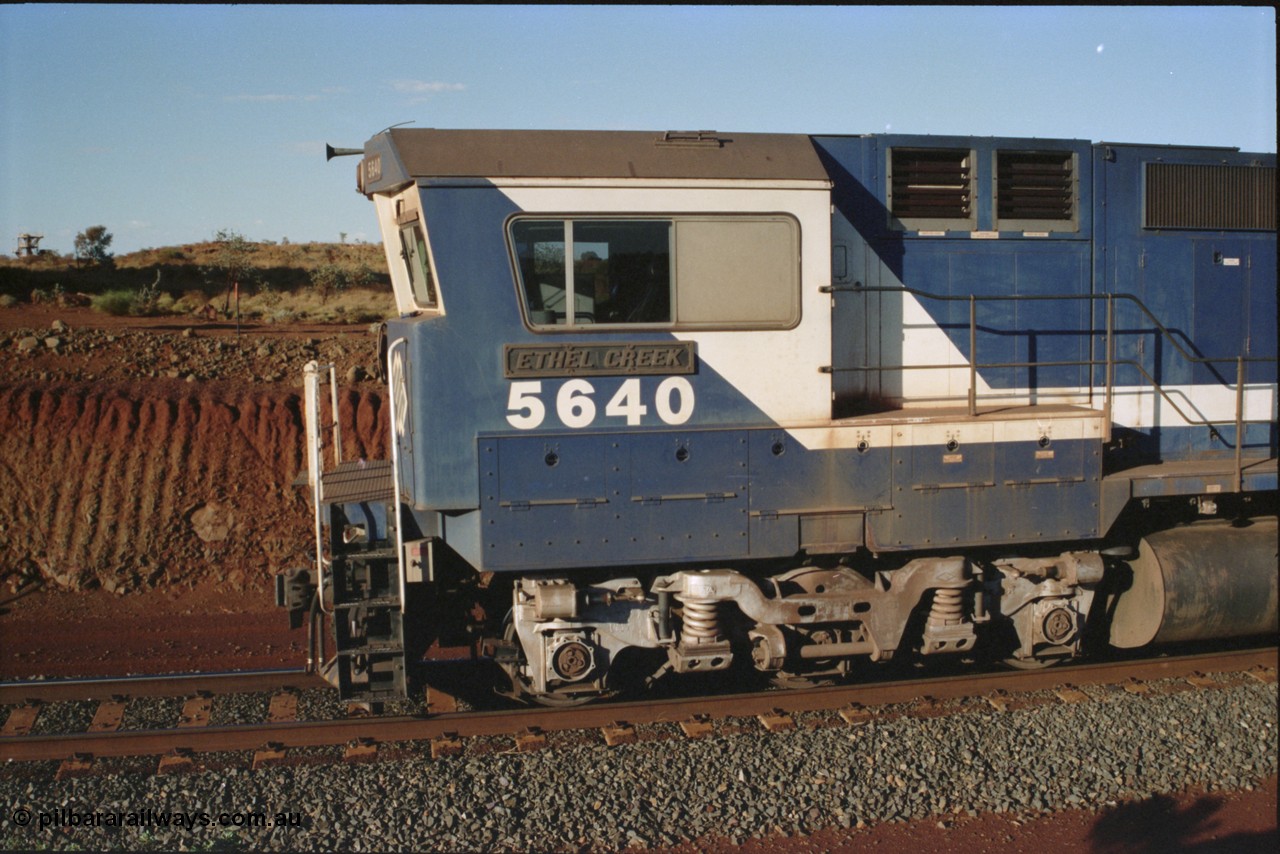 234-05
Yandi Two, BHP Iron Ore Goninan rebuild CM40-8M GE unit 5640 'Ethel Creek' serial 8281-05 / 92-129 is on the rear of a 240 waggon loaded train, this configuration was trialled for a time with two Dash 8 locos, 120 waggons, Dash 8, 120 waggons and Dash 8. View of left hand side of cab. Circa 1998.
Keywords: 5640;Goninan;GE;CM40-8M;8281-05/92-129;rebuild;AE-Goodwin;ALCo;M636C;5479;G6047-11;