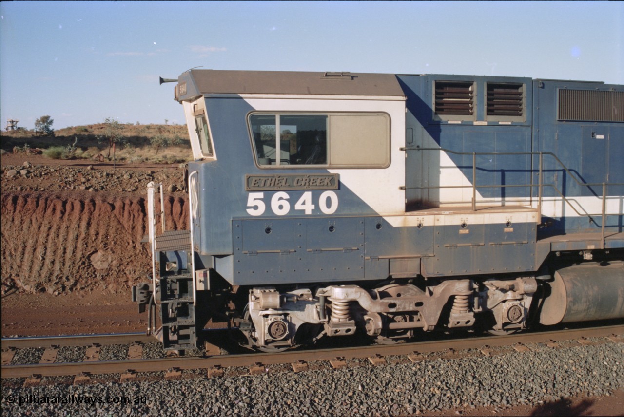 234-06
Yandi Two, BHP Iron Ore Goninan rebuild CM40-8M GE unit 5640 'Ethel Creek' serial 8281-05 / 92-129 is on the rear of a 240 waggon loaded train, this configuration was trialled for a time with two Dash 8 locos, 120 waggons, Dash 8, 120 waggons and Dash 8. View of left hand side of cab. Circa 1998.
Keywords: 5640;Goninan;GE;CM40-8M;8281-05/92-129;rebuild;AE-Goodwin;ALCo;M636C;5479;G6047-11;
