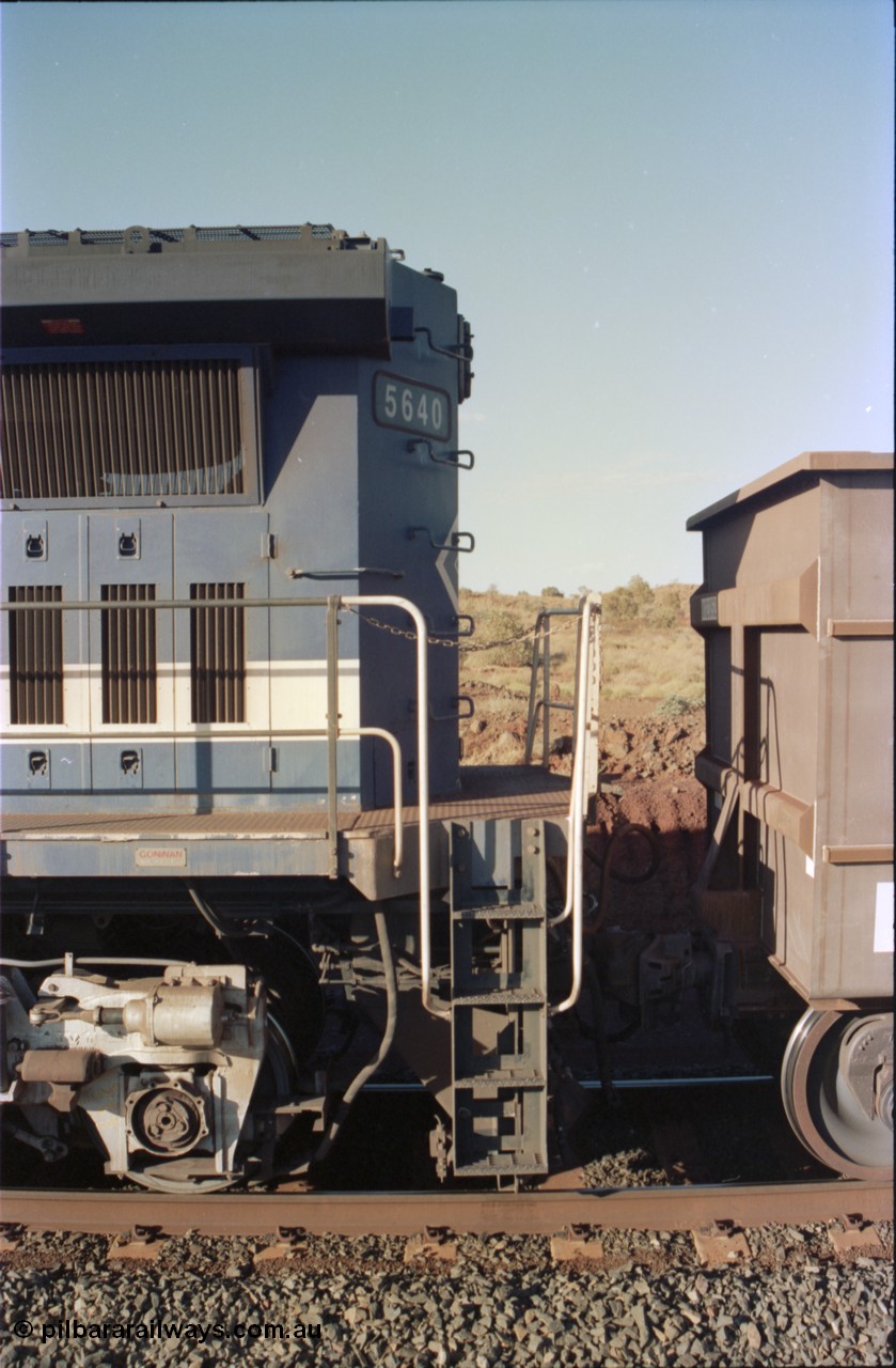 234-11
Yandi Two, BHP Iron Ore Goninan rebuild CM40-8M GE unit 5640 'Ethel Creek' serial 8281-05 / 92-129 is on the rear of a 240 waggon loaded train, this configuration was trialled for a time with two Dash 8 locos, 120 waggons, Dash 8, 120 waggons and Dash 8. View of left hand side rear end and coupling to waggon. Circa 1998.
Keywords: 5640;Goninan;GE;CM40-8M;8281-05/92-129;rebuild;AE-Goodwin;ALCo;M636C;5479;G6047-11;