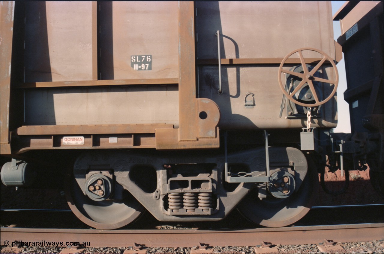 234-12
Yandi Two, loaded BHP Iron Ore waggon #4316 a Goninan built 3CR12 style stainless steel construction from 1997. Handbrake and bogie view.
Keywords: 4316;United-Goninan-WA;BHP-ore-waggon;