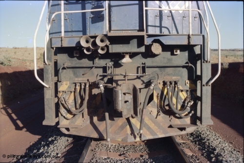 234-03
Yandi Two, BHP Iron Ore Goninan rebuild CM40-8M GE unit 5640 'Ethel Creek' serial 8281-05 / 92-129 is on the rear of a 240 waggon loaded train, this configuration was trialled for a time with two Dash 8 locos, 120 waggons, Dash 8, 120 waggons and Dash 8. View of front pilot. Circa 1998.
Keywords: 5640;Goninan;GE;CM40-8M;8281-05/92-129;rebuild;AE-Goodwin;ALCo;M636C;5479;G6047-11;