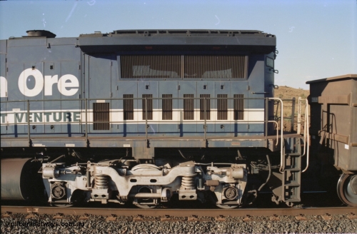 234-10
Yandi Two, BHP Iron Ore Goninan rebuild CM40-8M GE unit 5640 'Ethel Creek' serial 8281-05 / 92-129 is on the rear of a 240 waggon loaded train, this configuration was trialled for a time with two Dash 8 locos, 120 waggons, Dash 8, 120 waggons and Dash 8. View of left hand side radiator section. Circa 1998.
Keywords: 5640;Goninan;GE;CM40-8M;8281-05/92-129;rebuild;AE-Goodwin;ALCo;M636C;5479;G6047-11;
