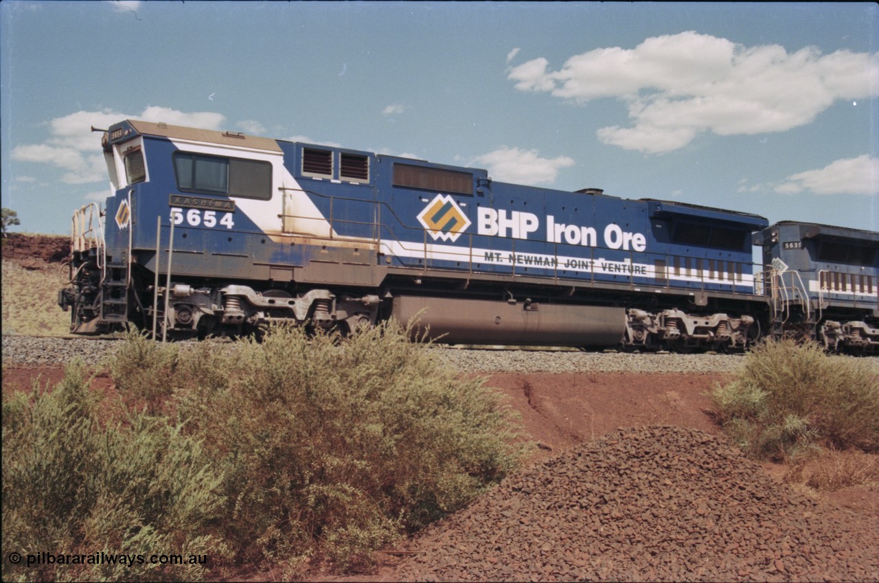 235-23
Yandi One, BHP Iron Ore Goninan rebuild CM40-8M GE unit 5654 'Kashima' serial 8412-11 / 93-145 sits on a loaded train awaiting departure time and also has the late marigold style BHP logo.
Keywords: 5654;Goninan;GE;CM40-8M;8412-11/93-145;rebuild;Comeng-NSW;ALCo;M636C;5493;C6084-9;