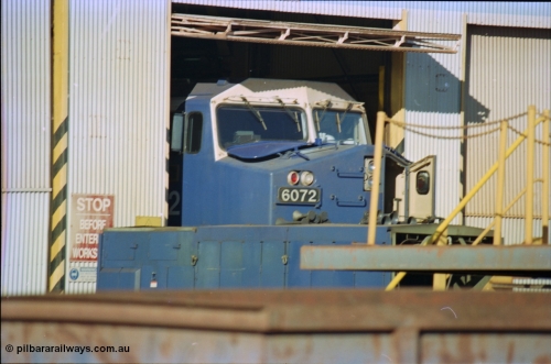 236-10
Nelson Point, Loco Overhaul Shop, BHP AC6000 class locomotive 6072 'Hesta', a General Electric built AC6000 model, serial 51064, seen here in the shed having the windscreen protectors or 'blinkers' fitted.
Keywords: 6072;GE;AC6000;51064;