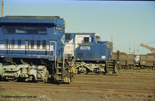 236-27
Nelson Point Loco Overhaul Shop, BHP Iron Ore's Goninan GE rebuilt CM40-8MEFI unit 5669 'Beilun' serial 8412-02 / 95-160 rear end with AC6000 unit 6076 beside it.
Keywords: 5669;Goninan;GE;CM40-8EFI;8412-02/95-160;rebuild;Comeng-NSW;ALCo;M636C;5486;C6084-2;