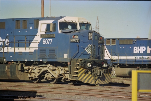 236-33
Nelson Point Loco Overhaul Shop, BHP Iron Ore's General Electric built AC6000 unit 6077 'Nimingarra' serial 51069 sits out the front.
Keywords: 6077;GE;AC6000;51069;